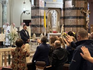 photo of Dr. Benitez being blessed during inaugural mass