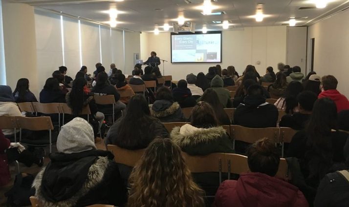 Students filling the seats while Dr. Johnson presents his research.